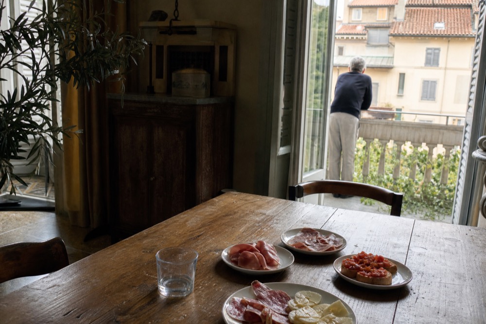 Small plates of Italian appetizers arranged on a wooden table