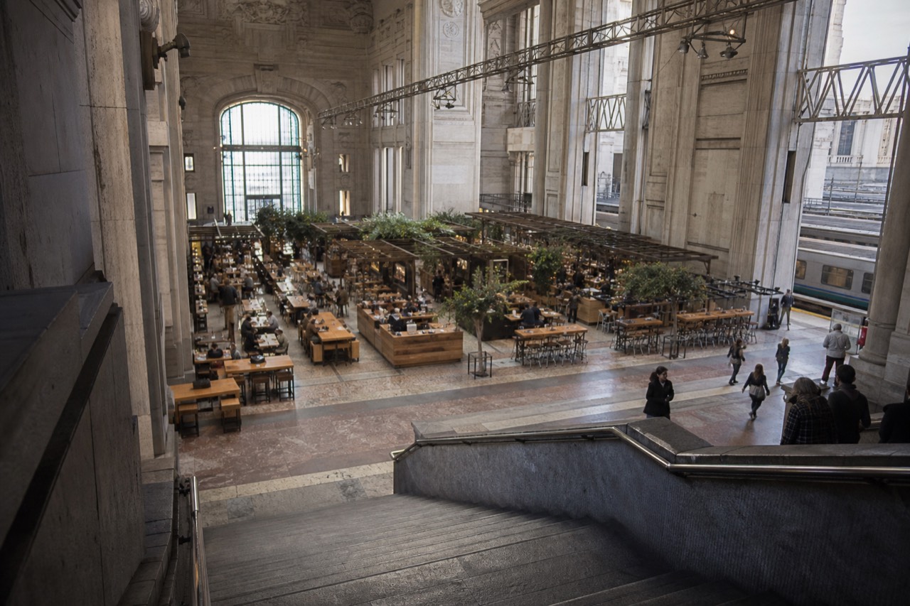 View of Mercato Centrale Milano food hall interior with stalls, seating, and the station's architecture