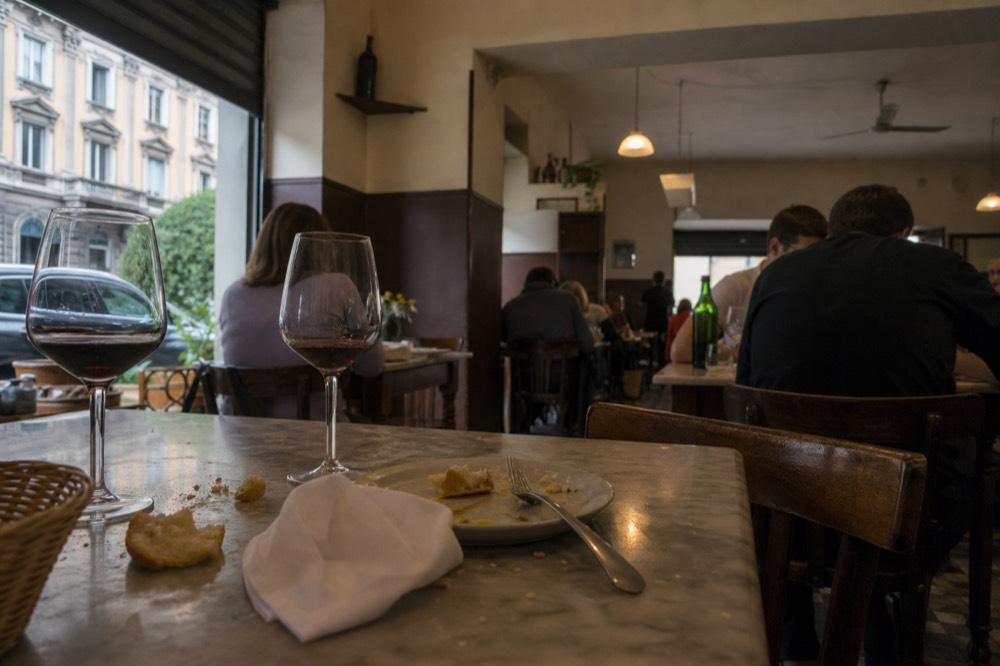 A close view of a chalkboard menu listing Italian daily dishes